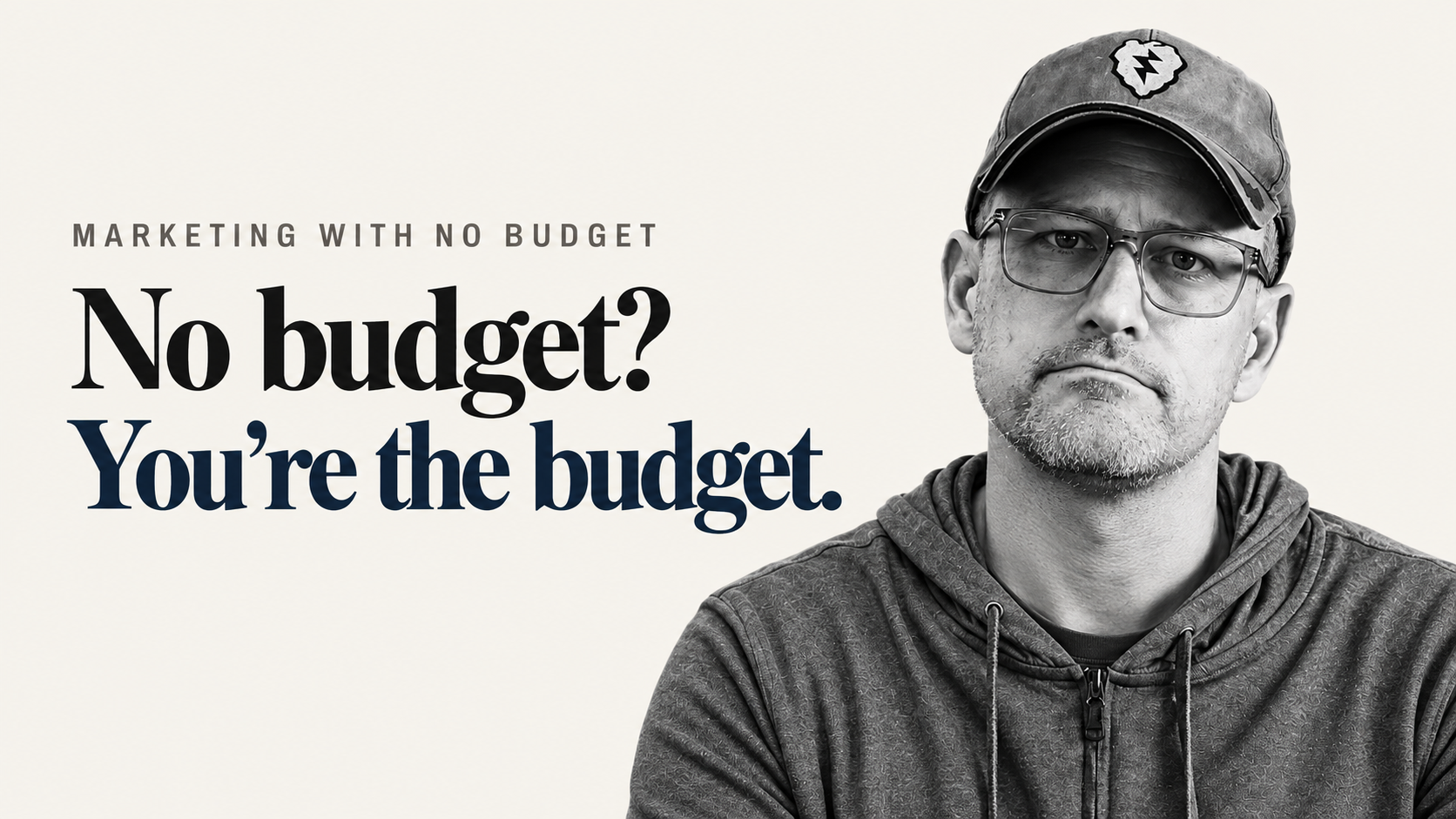 Black-and-white photo of Mike Birt in a cap and hoodie beside the headline "No budget? You're the budget." for a post on marketing with no budget.